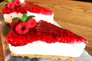 Receita de Cheesecake de framboesa com geleia de framboesa e crosta de biscoito de amêndoa